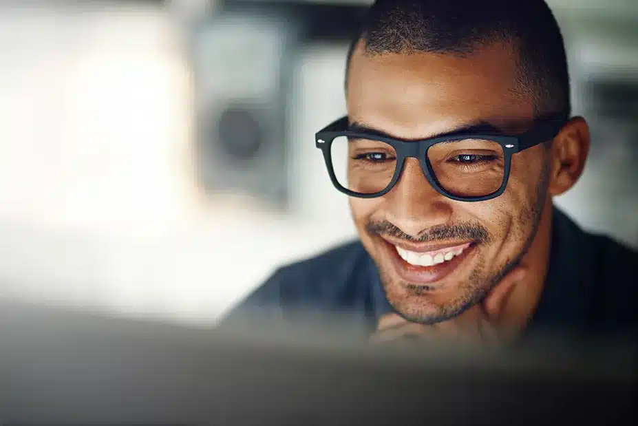 Man Reading on Laptop